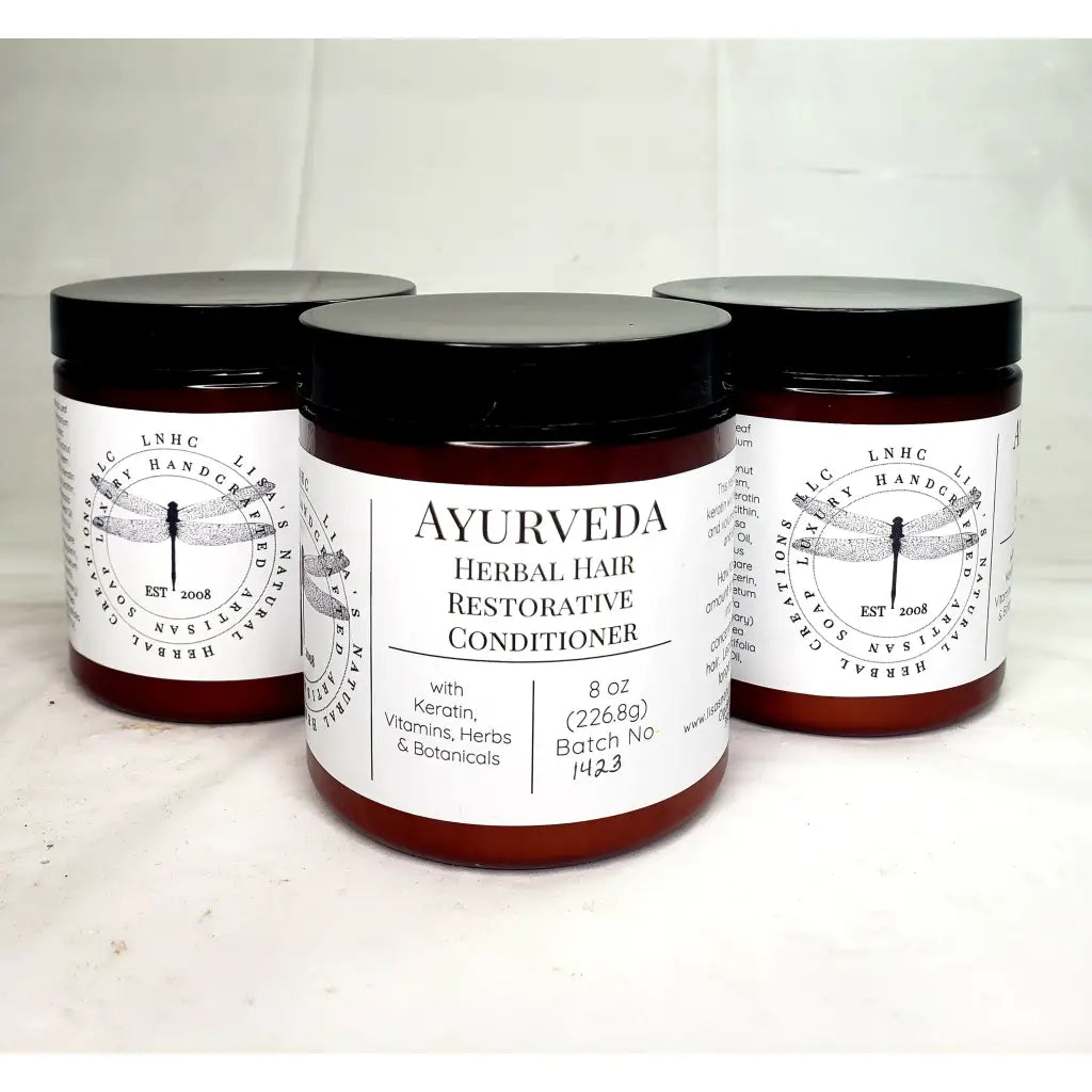 Ayurvedic herbal hair restorative conditioner in amber jars with black lids and white labels.