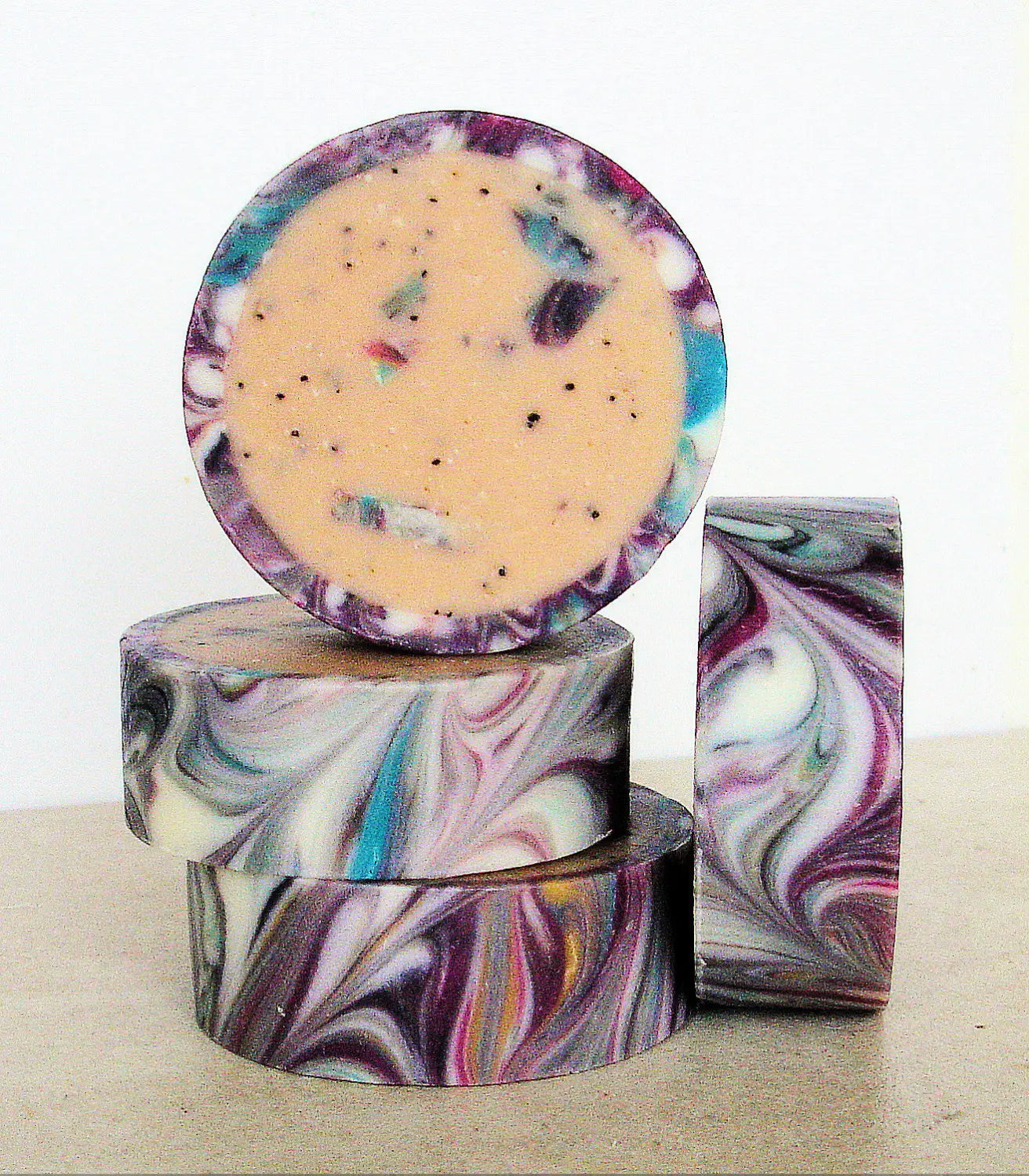 Colorful handmade soap bars with swirled patterns and marbled designs.