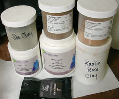 Assortment of cosmetic clays and powders with umber brown mica for cold process soap in Arches National Park