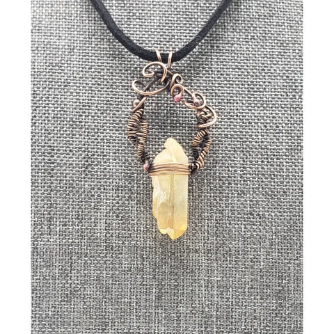 Crystal pendant necklace with intricate wire wrapping and a black cord.