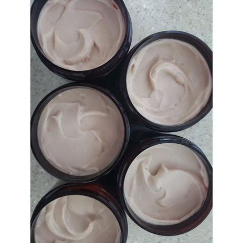 Ayurvedic herbal hair restorative conditioner in amber jars with black lids and white labels.