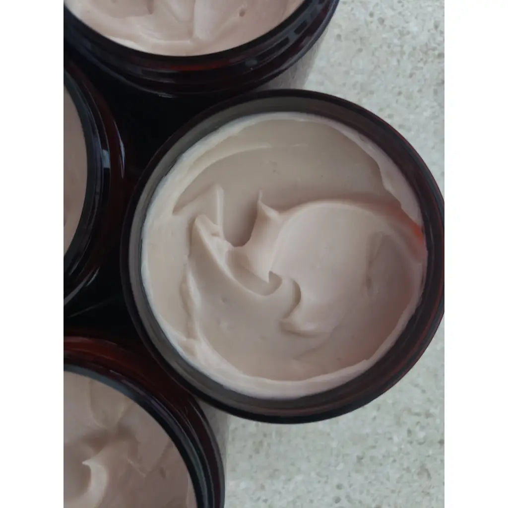 Ayurvedic herbal hair restorative conditioner in amber jars with black lids and white labels.