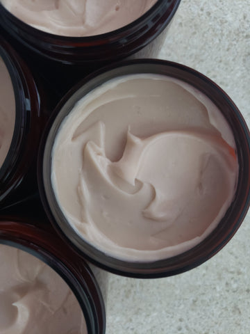Ayurvedic herbal hair restorative conditioner in amber jars with black lids and white labels.