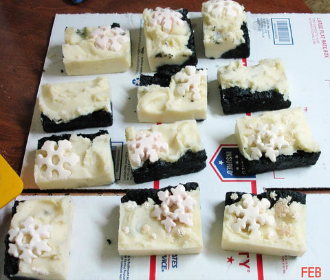 Bars of soap with dark base and light top, snowflake decorations for Mauna Kea Februarys Soap Challenge