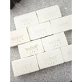 White soap bars with embossed dragonfly designs 
