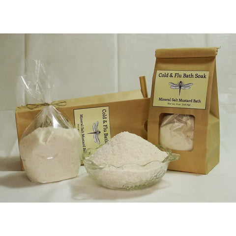 Cold & flu bath soak products in kraft paper packaging with mineral salt and mustard bath ingredients.