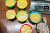 Cups of yellow pudding for Soap Challenge featuring oatmeal milk and shea butter