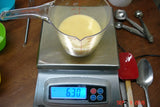 Digital kitchen scale displaying 630 grams for soap challenge with oatmeal milk and shea butter