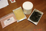 Four packages of powdered substances for pipe swirl soap challenge in slab mold