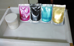 Colorful liquid pouches and white powder container for Rimmed Soap Challenge March 2016