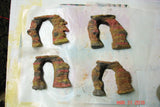 Rusty U-shaped metal objects resembling horseshoes for cold process soap inspired by Arches National Park using umber brown mica