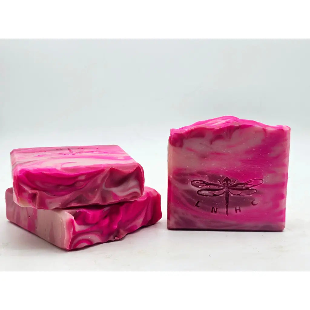 Pink marbled soap bars with dragonfly imprints.