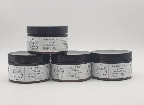 Hand and foot cream containers with minimalist black and white labels.
