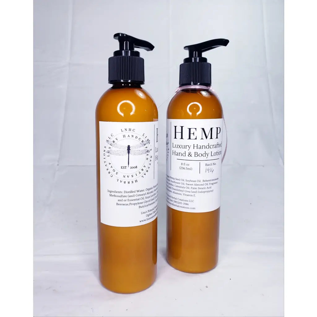 Two amber-colored bottles of hemp-based hand and body lotion with pump dispensers.