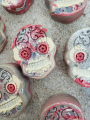 Intricately decorated sugar skulls with floral and gear motifs for acrylic string pull art