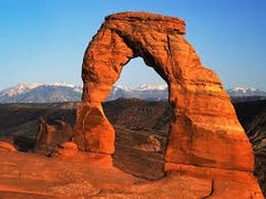 Natural sandstone arch at Arches National Park with reddish-orange hue, ideal for cold process soap inspiration using umber brown mica