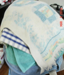 Colorful blankets and towels stacked neatly for Rimmed Soap Challenge March 2016