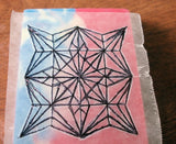 Translucent paper with black geometric pattern and watercolor background for carved soap craft