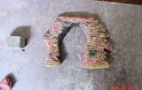Pink and tan artificial rock arch made with cold process soap inspired by Arches National Park using umber brown mica