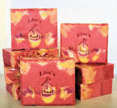 Red and yellow tear drop swirl soap bars featuring Sea Island Grapefruit in a drop swirl design