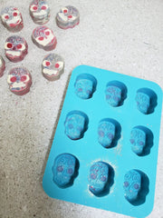 Silicone mold for skull-shaped treats in acrylic string pull soap making with natural herbal creations in lapis blue