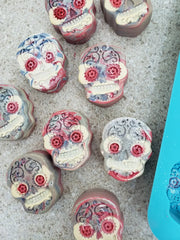 Colorful sugar skull candies in lapis blue and vibrant designs for acrylic string pull art