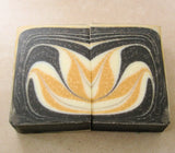 Artisanal soap bars with black, white, and orange swirl pattern for Great Cakes Soap Challenge