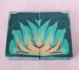 Two soap bars with green, yellow, and brown lotus design from Great Cakes Soap Challenge