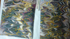 Handmade rimmed soap bars with intricate purple, green, white, and gold swirls for soap challenge