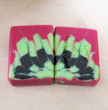 Layered soap bars with pink, black, and green layers from My Journey Through Great Cakes Soap Challenge
