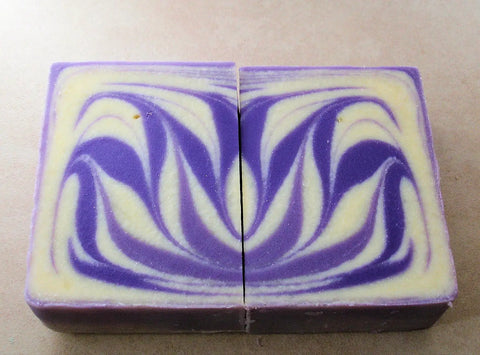 Purple and cream swirled soap bars from the Great Cakes Soap Challenge showing a soap recipe