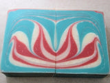 Soap challenge soap recipe featuring two red, white, and blue swirled soap bars
