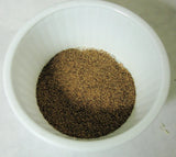 White bowl with dark brown umber brown mica for cold process soap inspired by Arches National Park