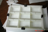 White plastic tray with twelve compartments for cold process soap in Arches National Park using umber brown mica